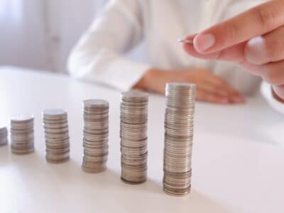 Rising coins stacks, business profit, money saving
