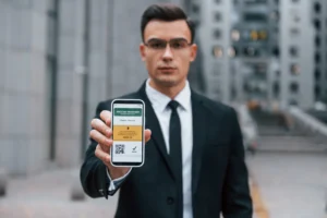 Man in suit paying with venmo phone app